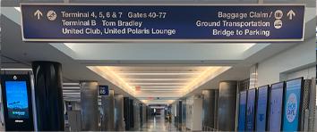 Signage indicating direction of terminals at LAX airport.
