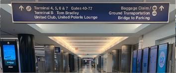 Signage indicating direction of terminals at LAX airport.